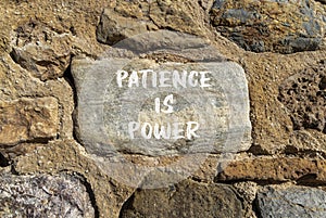 Patience is power symbol. Concept words Patience is power on beautiful big grey stone. Beautiful stone wall background. Business