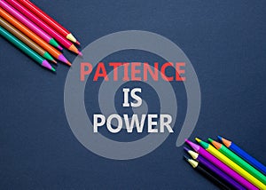 Patience is power symbol. Concept words Patience is power on beautiful black paper. Beautiful black table black background.