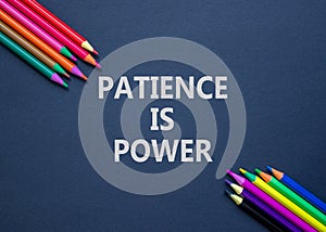 Patience is power symbol. Concept words Patience is power on beautiful black paper. Beautiful black table black background.