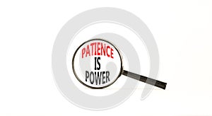 Patience is power symbol. Concept words Patience is power in beautiful magnifying glass. Beautiful white table white background.