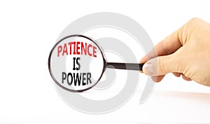 Patience is power symbol. Concept words Patience is power in beautiful magnifying glass. Beautiful white table white background.