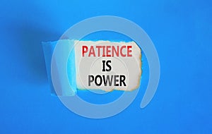 Patience is power symbol. Concept words Patience is power on beautiful white paper. Beautiful blue paper background. Business and