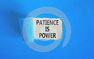 Patience is power symbol. Concept words Patience is power on beautiful white paper. Beautiful blue paper background. Business and