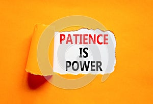 Patience is power symbol. Concept words Patience is power on beautiful white paper. Beautiful orange paper background. Business