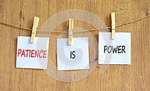Patience is power symbol. Concept words Patience is power on beautiful white paper on clothespin. Beautiful wooden table wooden