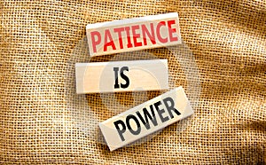 Patience is power symbol. Concept words Patience is power on beautiful wooden blocks. Beautiful canvas table canvas background.