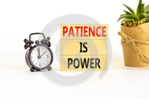 Patience is power symbol. Concept words Patience is power on beautiful wooden blocks. Beautiful white table white background.