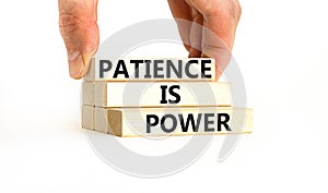 Patience is power symbol. Concept words Patience is power on beautiful wooden blocks. Beautiful white table white background.