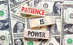 Patience is power symbol. Concept words Patience is power on beautiful wooden blocks. Dollar bills. Beautiful dollar bills