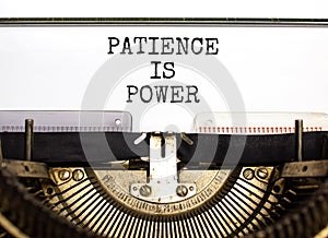 Patience is power symbol. Concept words Patience is power typed on beautiful old retro typewriter. Beautiful white paper