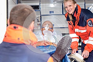 Patient in ambulance car with paramedics rescue photo