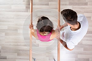 Patient Being Assisted By Physical Therapist While Walking