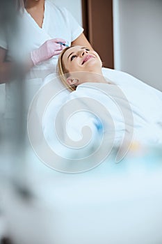 Patient being injected the platelet-rich plasma into the scalp