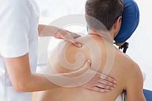Patient being massaged by female therapist