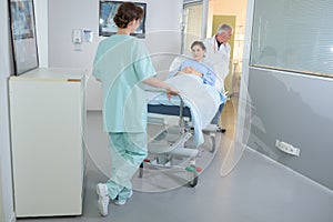 Patient being wheeled on hospital stretcher