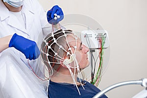 Patient brain testing using encephalography at medical center