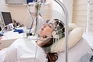 Patient brain testing using encephalography at medical center