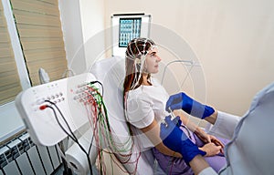 Patient brain testing using encephalography at medical center