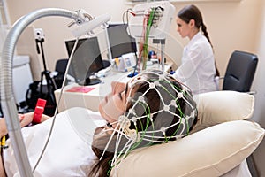 Patient brain testing using encephalography at medical center