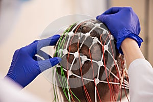 Patient brain testing using encephalography at medical center