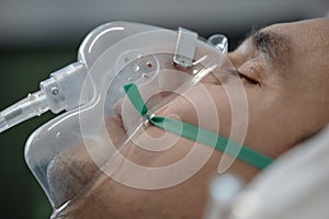 Patient breathing with oxygen mask