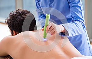 Patient in clinic undergoing laser scar removal