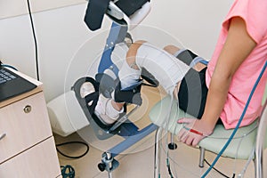 Patient on Continuous Passive Range of Motion machines. Device to provide anatomically correct motion to both the ankle