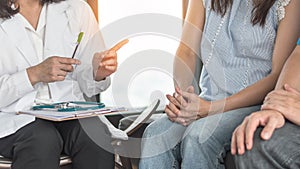 Patient couple consulting with doctor or psychologist on marriage counseling, family medical healthcare therapy