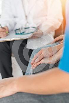 Patient couple consulting with doctor or psychologist on marriage counseling, family medical healthcare therapy, IVF