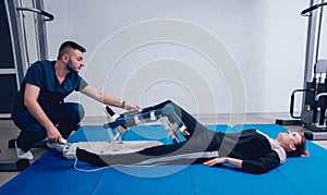 Patient on CPM machines. Continuous passive range of motion.