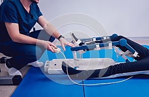 Patient on CPM machines. Continuous passive range of motion.