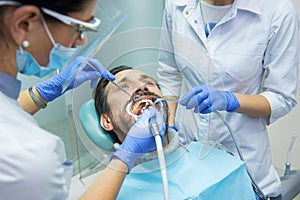 Patient with dental doctors.