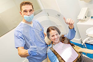 Patient and dentis showing thumbs up together