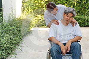 The patient is depression are sitting in a wheelchair caused by the loss of a loved one and some physical diseases and a side effe