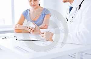Patient and doctor prescribing medication