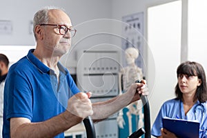 Patient doing exercises with sport equipment and gear