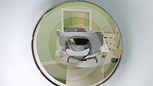 Patient Entering An MRI. Male patient is moving into a CT-scanner. Medical equipment: computed tomography machine in