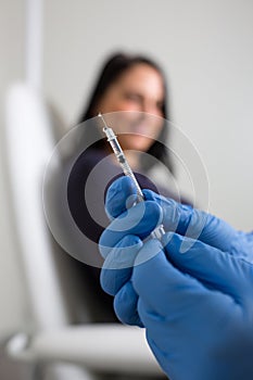 Patient getting a vaccine shot from a doctor nurse