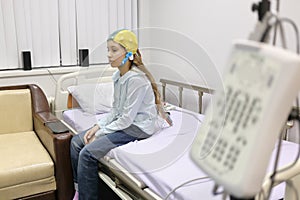 Patient girl on procedure of removing of photo