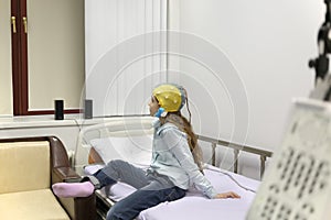 Patient girl on procedure of removing of photo