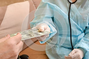 The patient gives the doctor money, a bribe for treatment. The concept of corrupt doctors