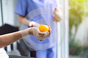 Patient hand massage with ball at nursing home,Physical therapy,Caregiver take care and support