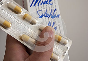 A patient has a pack of pills, people are taking pills unnecessarily photo