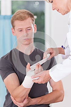 Patient having bandaged hand photo