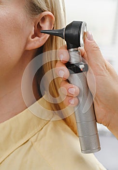 patient having check-up of hearing at doctor otolaryngologist