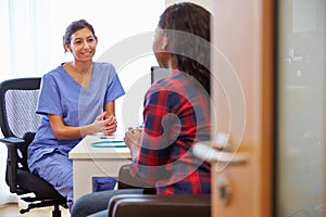 Patient Having Consultation With Female Doctor In Office