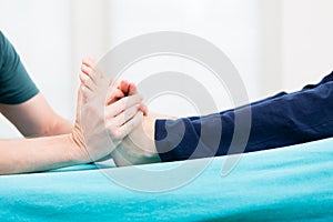 Patient having foot massage at physio