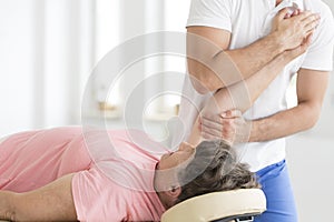 Patient having her hand stretched