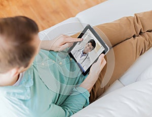 Patient having video chat with doctor on tablet pc
