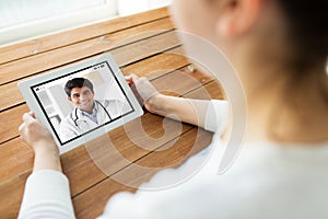 Patient having video chat with doctor on tablet pc